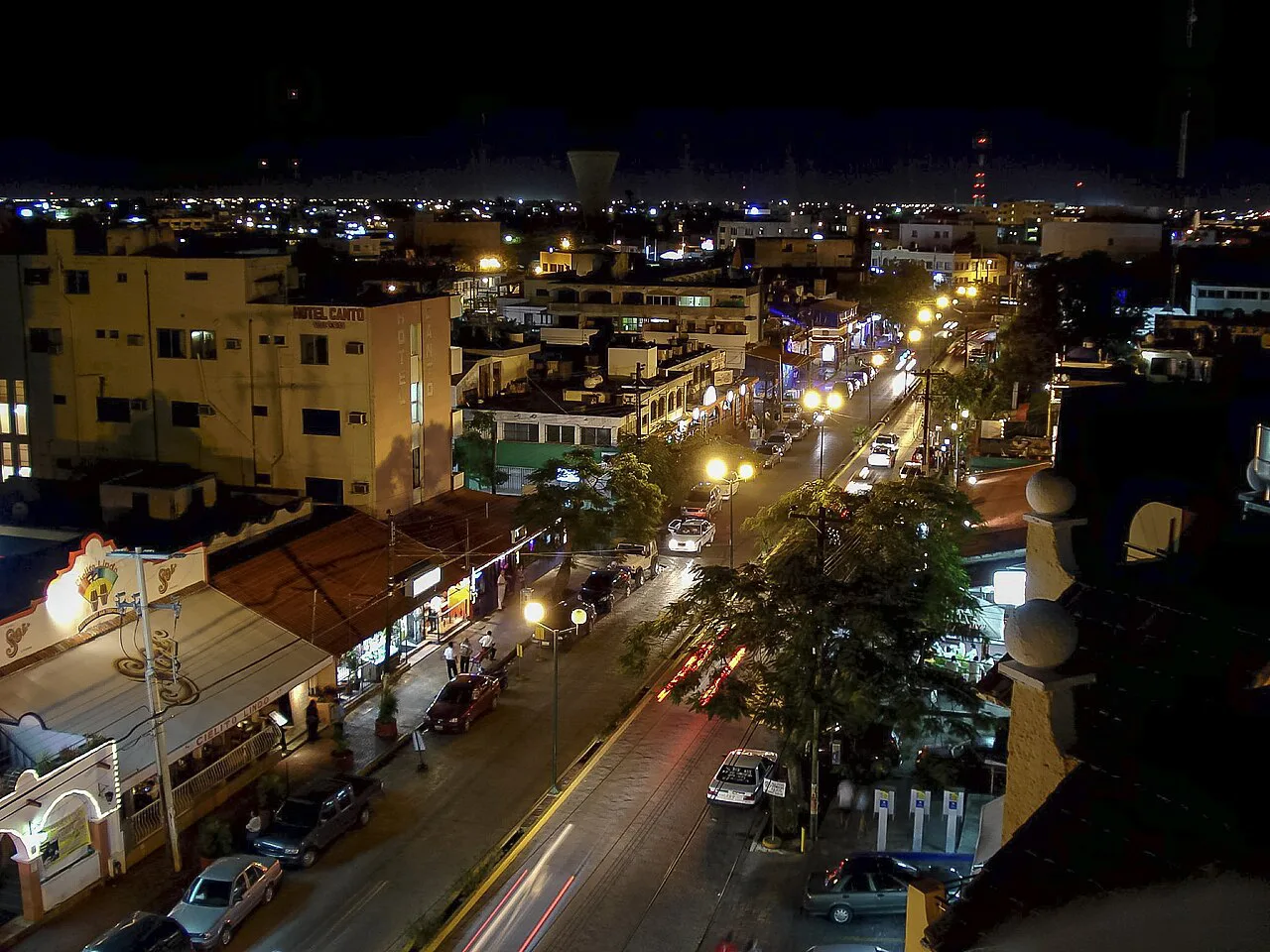 Avenida Yaxchilán in downtown Cancún lit up at night.