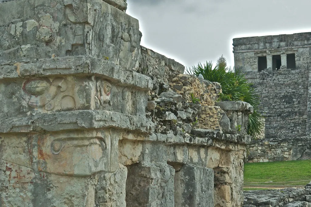 Carved stone walls of the Maya ruins at Tulum.