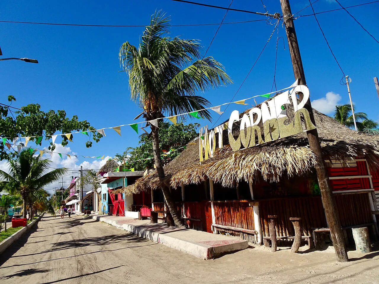 Thatched Hot Corner bar on a sandy street on Isla Holbox.