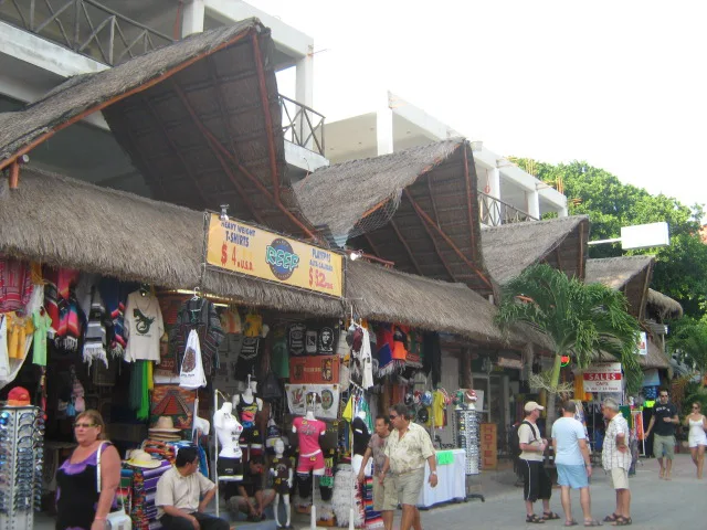 Shops under thatched roofs along Quinta Avenida, Playa del Carmen.