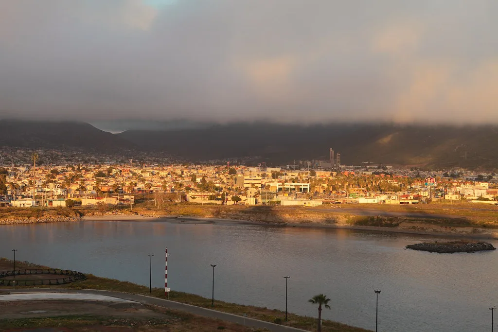 Ensenada at twilight, with clouds over the hills.