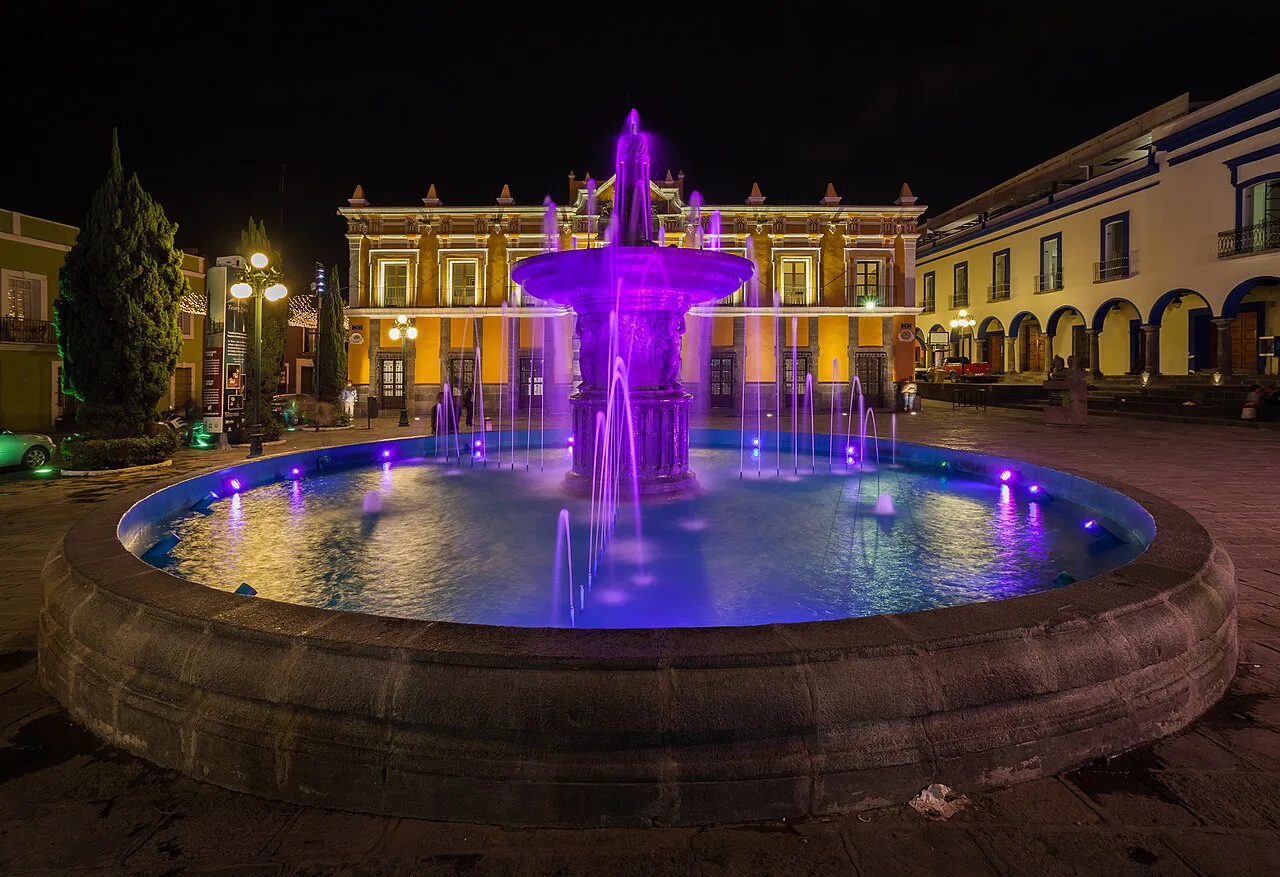 Illuminated fountain in front of the Teatro Principal in Puebla.