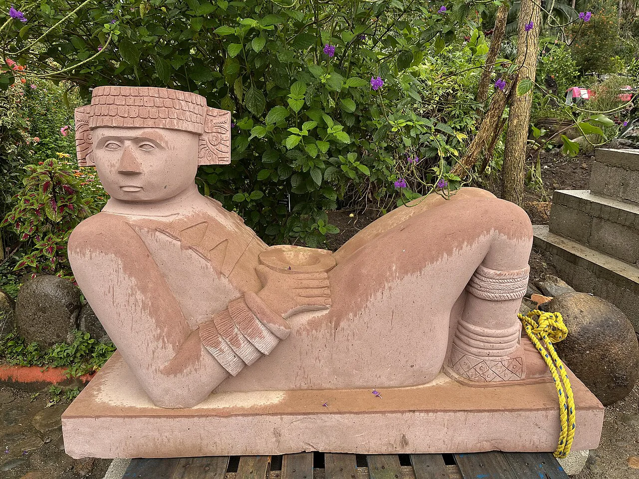 Reclining stone sculpture at Vallarta Botanical Garden.