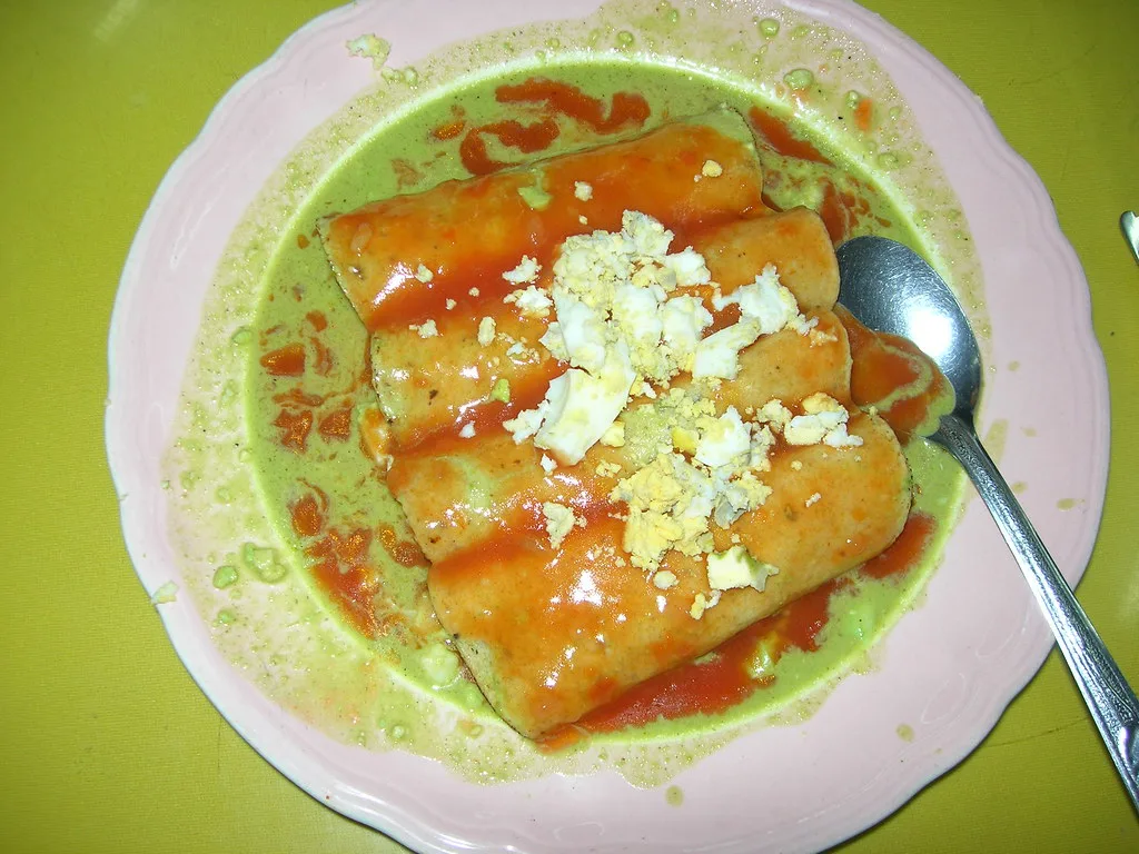 Papadzules, a Yucatán dish of egg-filled tortillas in pumpkin-seed sauce.