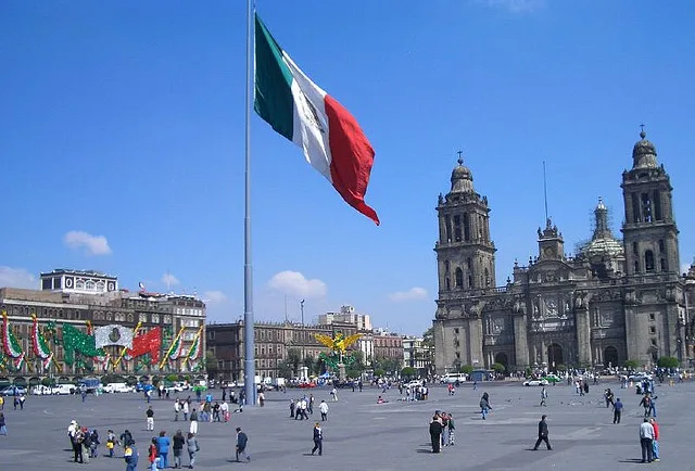 The giant flag and Metropolitan Cathedral on the Zócalo, Mexico City.